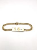 A yellow metal plated curb link identity bracelet, engraved Maya. L.18cm 15.22g