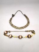 A 9ct gold WJP lady shell cameo articulated bracelet (one cameo missing) along with a 9ct gate
