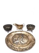 A collection of silver and white metal, including a pair of Indian repoussé white metal (tests as