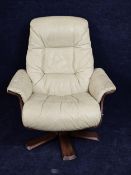 A contemporary Scandinavian leather upholstered armchair with reclining swivel action.