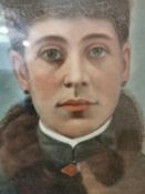 A 19th century oil on canvas on board portrait of a Russian lady in hat and fur collar coat.