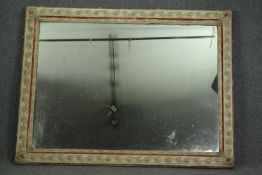 A large wall mirror, C.1900, painted gesso on carved frame with original plate. H.135 W.170cm.
