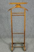 A vintage Italian beech framed clothes valet by Brevettato, stamped with maker's mark. H.110 W.44cm.