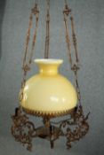 A vintage ceiling light in the style of an oil lantern. H.100cm.