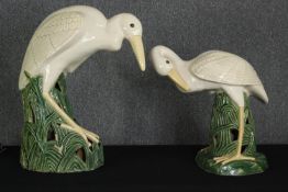 A pair of glazed earthenware wading birds, modern, H.64cm. (largest).