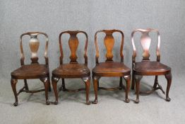 A set of four early 20th century oak George I style dining chairs with leather seats. (One stretcher
