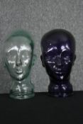 Two 20th century glass milliners mannequin pressed glass heads having moulded features, one dark