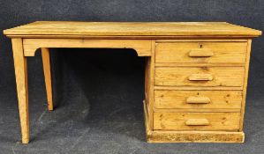 A pine desk, circa 1940. H. 75 W.153 D.75cm.