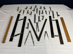 A collection of protractors, compasses and rules.