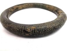 An ancient Iranian bronze torque arm bracelet/necklace with incised design. Diameter 12cm,
