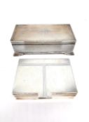 Two Art Deco engine turn decorated cedar lined silver cigarette boxes. One with engraved geometric
