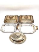 A pair of 19th century silver plate covered serving dishes with scrolling foliate design by James