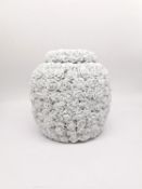 A large lidded Chinese style ginger jar decorated with applied white sculptural roses. H.28 diameter