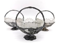 A collection of three silver plated sculptural vine and grape design sugar bowls with frosted cut