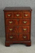 A walnut reproduction music cabinet. H.97 W.69 D.48cm.
