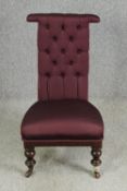 A Victorian mahogany prie dieu chair with modern aubergine textured upholstery. H.96cm.