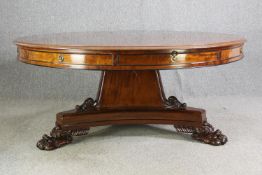 A late Regency style mahogany drum top dining or centre table, bearing a Waring & Gillows