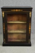 A Victorian ebonized and inlaid pier cabinet, circa 1860 with gilt metal mounts. H.98 W.74 D.32cm.