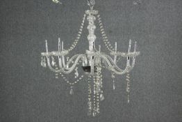An eight branch crystal chandelier with swags and drops. (needs repair) H.72 Dia.60cm.