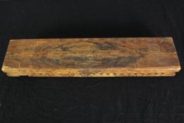 A vintage Dutch cigar press mould, with cigars. H.7 W.56 D.12cm.
