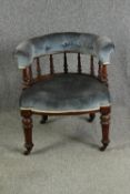 A late Victorian walnut tub chair, with button back upholstery