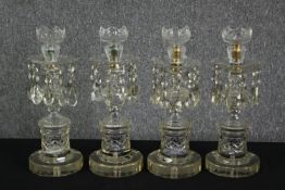 A set of four cut glass lustres, 19th century. H.39cm. (each).