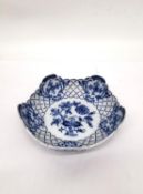 A blue on white ground 'blue onion pattern' pierced Colln Meissen dish. Diameter 15.5cm