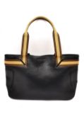 A Gucci Black web leather tote handbag with brown and beige strap. Magnetic snap closure and