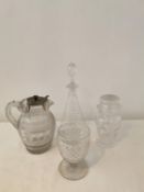 A cut glass decanter with wave pattern, a cut crystal and silver plate punch jug, a lead crystal