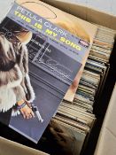 A mixed box of records.