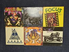 6 hard rock LP's including works by Bon Jovi, Dio, David Lee Roth, Def Leppard, Focus and Aerosmith.
