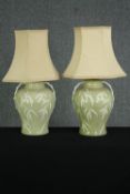 A pair of celadon glazed baluster table lamps, with bamboo decoration. H.49cm. (largest).
