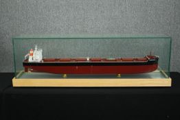 † A ship's model of a tanker, in a perspex show case. H.42 W.127 D.28cm.
