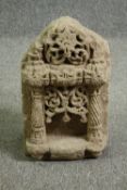 † A 17th-19th century Indian carved stone shrine for a religious icon. H.43 W.24 D.22cm.