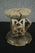 † A Shona carved hardwood stool. H.24 Dia.24cm.