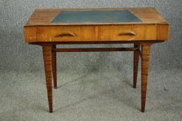 A Beresford and Hicks mid 20th century retro teak writing table. H.76 W.105 D.55cm.