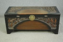 A 1920's Chinese camphorwood coffer. H.52 W.120 D.50cm.