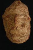 † An African stone head of an ancestor, Congo region. H.19cm.