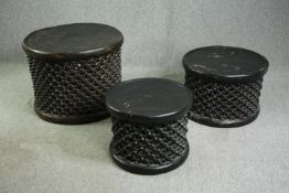 † Three African carved hardwood Bamileke stools, H.57 Dia.76cm. (largest)