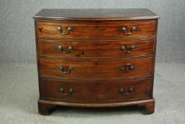 A George III mahogany bowfront chest of drawers. H.94 W.110 D.58cm.