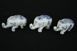 † A group of three miniature Delft elephants. L.7cm. (each).