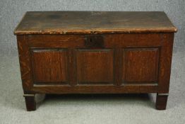 A late 17th century oak coffer, on associated block feet. H.64 W.109 D.45cm.