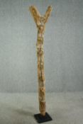 † A carved hardwood granary ladder, 20th century, West African, Dogon tribe. H.196cm.