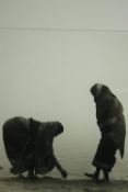 † A limited edition photograph of two African women beside a lake, signed, dated and numbered.