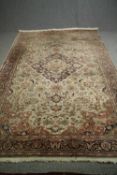 A mid 20th century Tabriz style carpet. L.303 W.196cm.