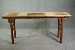 † A 19th century Chinese elmwood altar/console table. H.85 W.180 D.38cm.