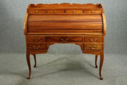 A walnut tambour roll top desk, in George II manner. H.120 W.126 D.52cm.