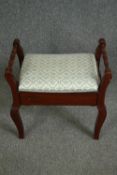 An Edwardian mahogany piano stool. H.52 W.55 D.34cm.