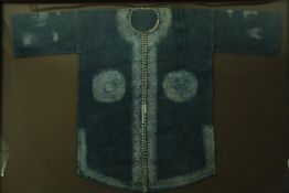 † Tribal tunic with batik design, framed and glazed. H.113 W.163cm.