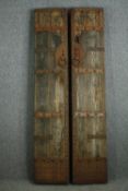† A pair of Chinese 19th century hardwood and metal bound courtyard/temple doors. H.220 W.41cm. (